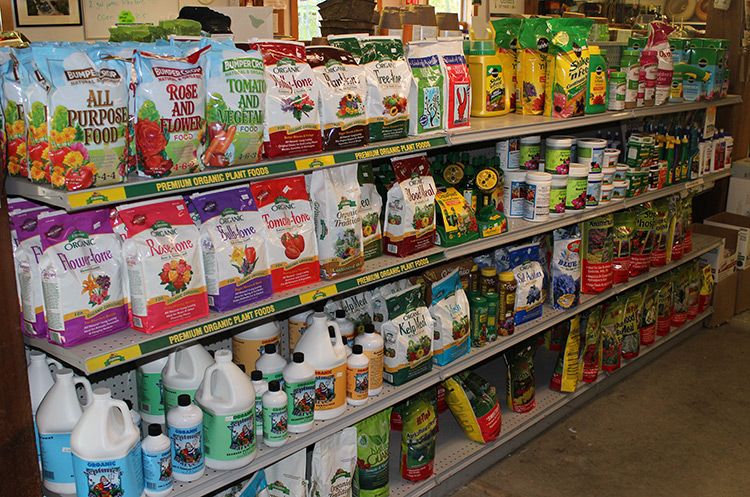 Shelves of Lawn Fertilizer Products at Coastal Landscaping and Garden Center